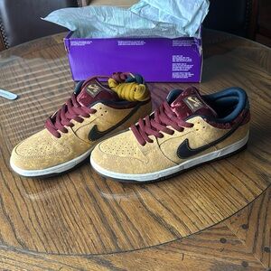 Nike SB Dunk Low Pro
Celestial Gold · Black · Dark Team Red, brand new